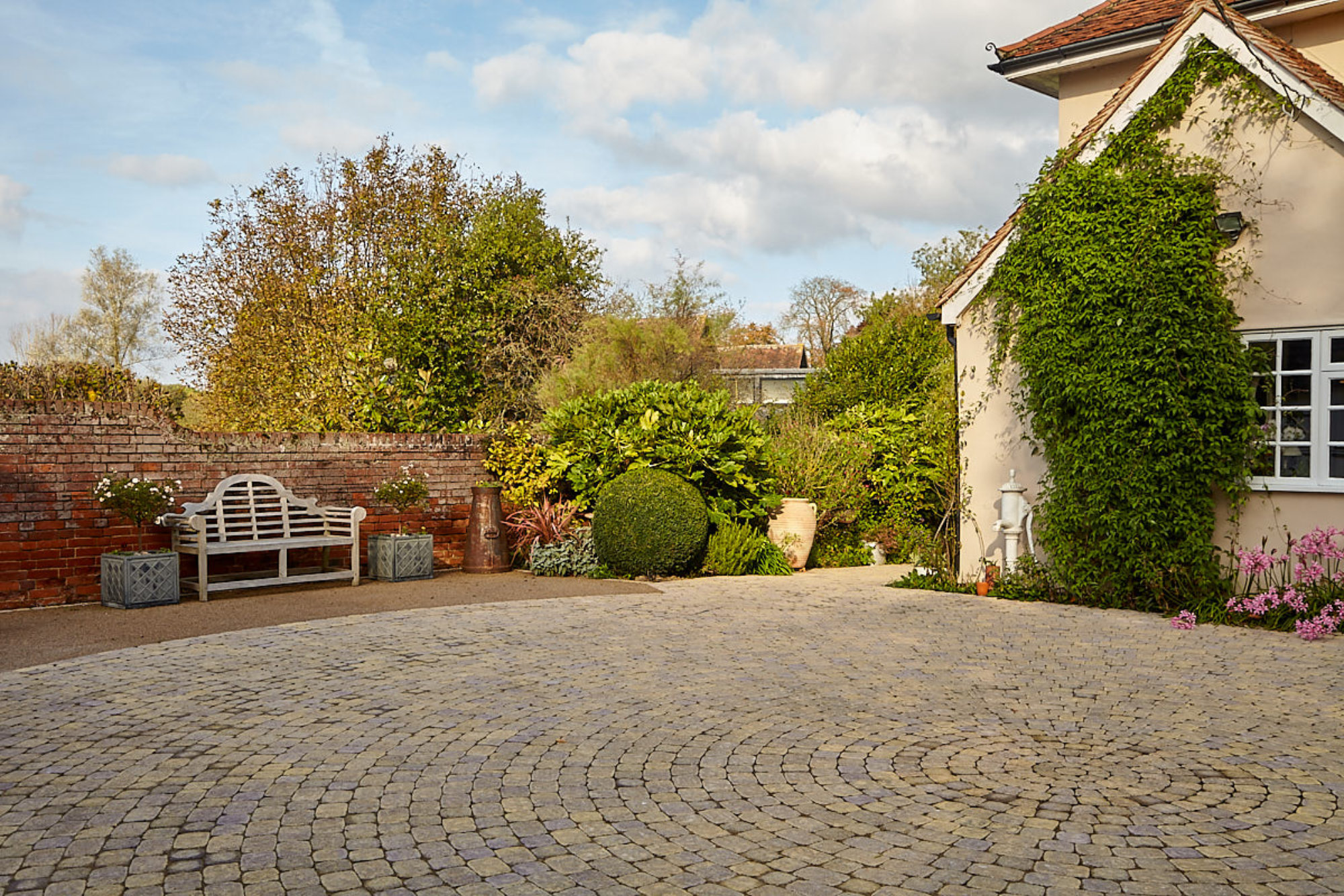 A Rustic and Charming Driveway Entrance with Aura Block Paving