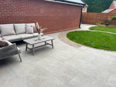 Eden Limestone Porcelain Garden Design in shade Mink with Aura Cobbled Block Paving Borders Porcelain patio | porcelain paving | garden design | essex | paving contractor essex | garden landscapers near me | garden landscapers essex | patio design Garden landscapers Driveway installers Landscapers in essex Garden designers Paving contractors Garden design Paving contractors near me Garden designers near me Garden landscapers near me Elite paving
