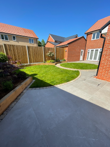 Eden Limestone Porcelain Garden Design in shade Mink with Aura Cobbled Block Paving Borders Porcelain patio | porcelain paving | garden design | essex | paving contractor essex | garden landscapers near me | garden landscapers essex | patio design Garden landscapers Driveway installers Landscapers in essex Garden designers Paving contractors Garden design Paving contractors near me Garden designers near me Garden landscapers near me Elite paving